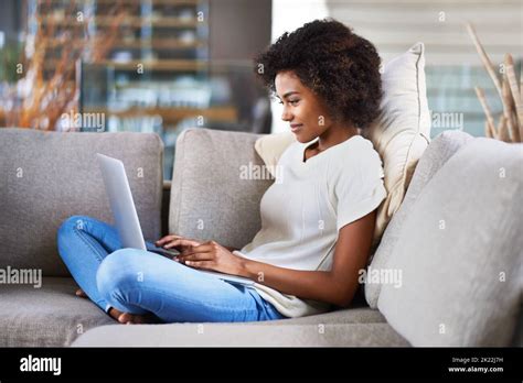 Staying connected is just so easy nowadays. a young woman using a ...