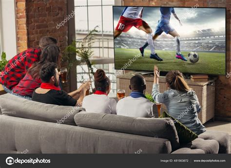 People Watching Football On Television