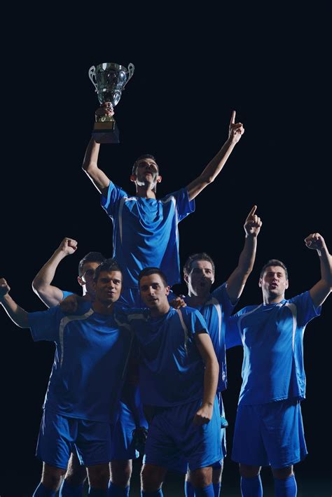 soccer players celebrating victory 11639624 Stock Photo at Vecteezy