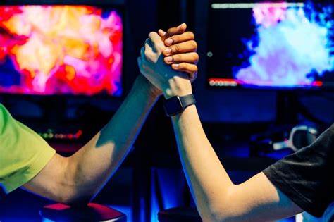 Premium Photo | Multiethnic group of young friends playing videogames