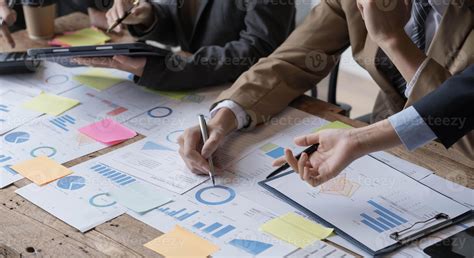 Close up of Business team analyzing income charts and graphs with ...