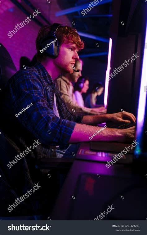 Team Professional Gamers Wearing Headphones Playing Stock Photo ...