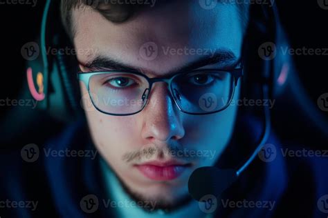 Young gamer focused on competitive play during late-night gaming ...