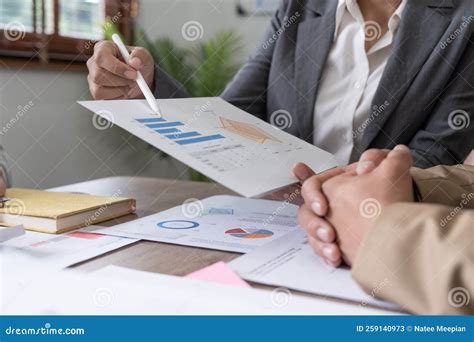 Business Team Analyzing Income Charts and Graphs with Modern Laptop ...