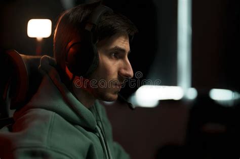Focused Male Gamer in Headphones Playing Computer Game Stock Image ...