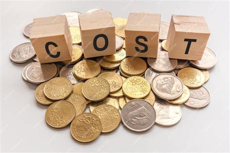 Premium Photo | Cost concept with stacked coins on wooden cube