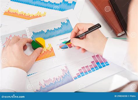 Businessman Analyzing Charts And Graphs Stock Photo | CartoonDealer.com ...