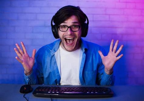 Premium Photo | Happy delighted gamer winning online computer game