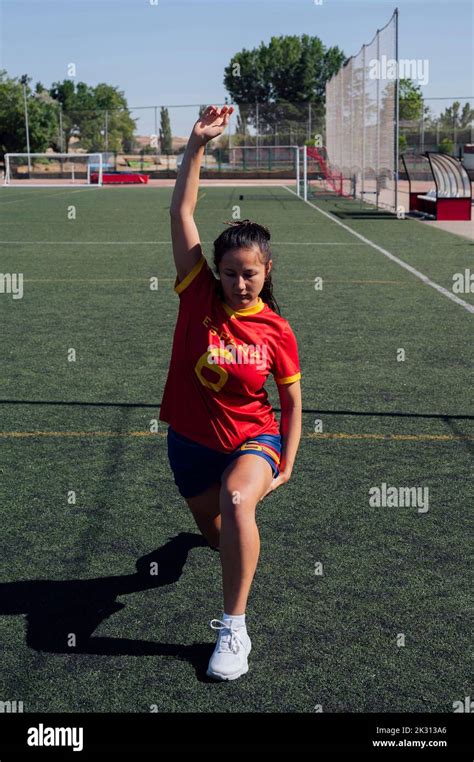 Player doing warm up exercise on sports field Stock Photo - Alamy