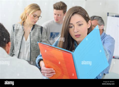Beautiful young woman reviewing hi-res stock photography and images - Alamy