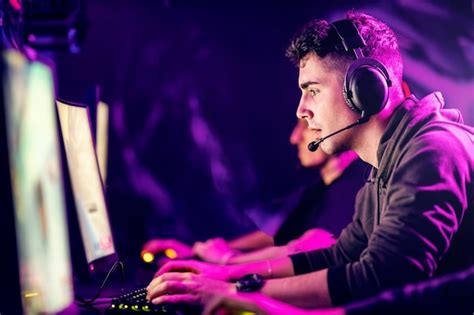 Premium Photo | Focused gamer playing favorite game at gaming room