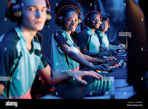 Young professional esports players playing games in internet cafe Stock ...