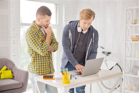 Thoughtful Male Colleagues Typing Answer Stock Photo - Image of ability ...