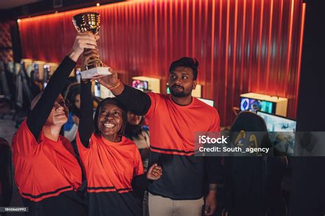 Professional Esports Team Celebrating Victory With Trophy Stock Photo ...
