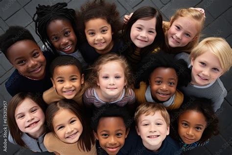 Faces of children of different races and ethnicities stare into the ...