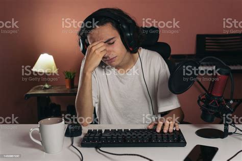 Young Gamer Boy With Headache Touching His Face Out Of Frustration Or ...