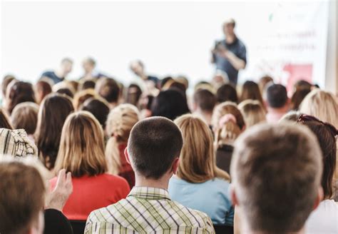 Audience in small classroom. Adult students listen to professor. Group ...