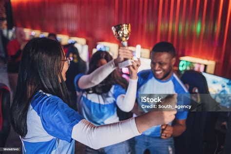 Professional Esports Team Celebrating Victory With Trophy Stock Photo ...