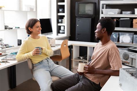 Free Photo | Colleagues taking a break from repairing computers