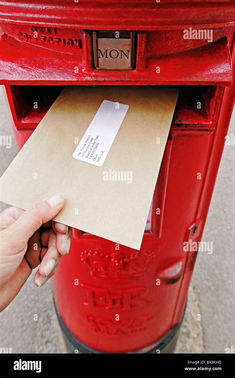 Posting a Letter Into a Post Box, UK Stock Photo: 33272665 - Alamy