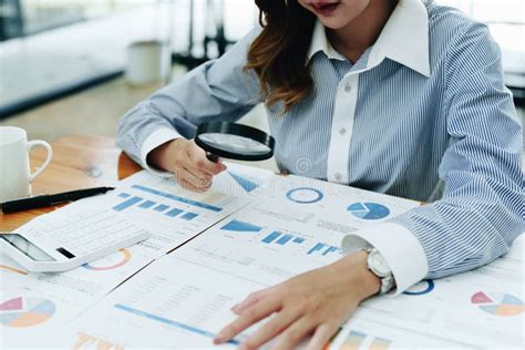 Financial Analysts Analyzing Business Financial Reports are Examining ...