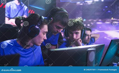 Gamers Discussing Strategy with Coach before Match Stock Image - Image ...