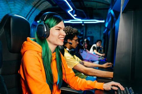 Premium Photo | Multiethnic group of young friends playing videogames