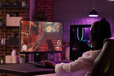 Over shoulder view of african american gamer girl playing online games ...