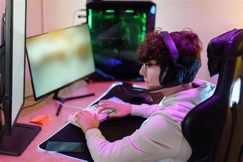 Premium Photo | Top view of concentrated young male gamer in eyeglasses ...