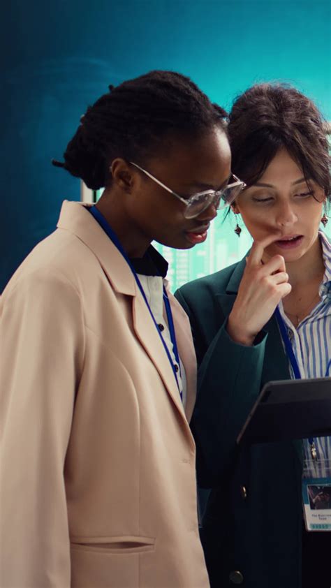 Team of business analysts reviews feedback on previous projects to work ...